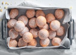 Sweet donut balls with powdered sugar. Donuts easy to make.