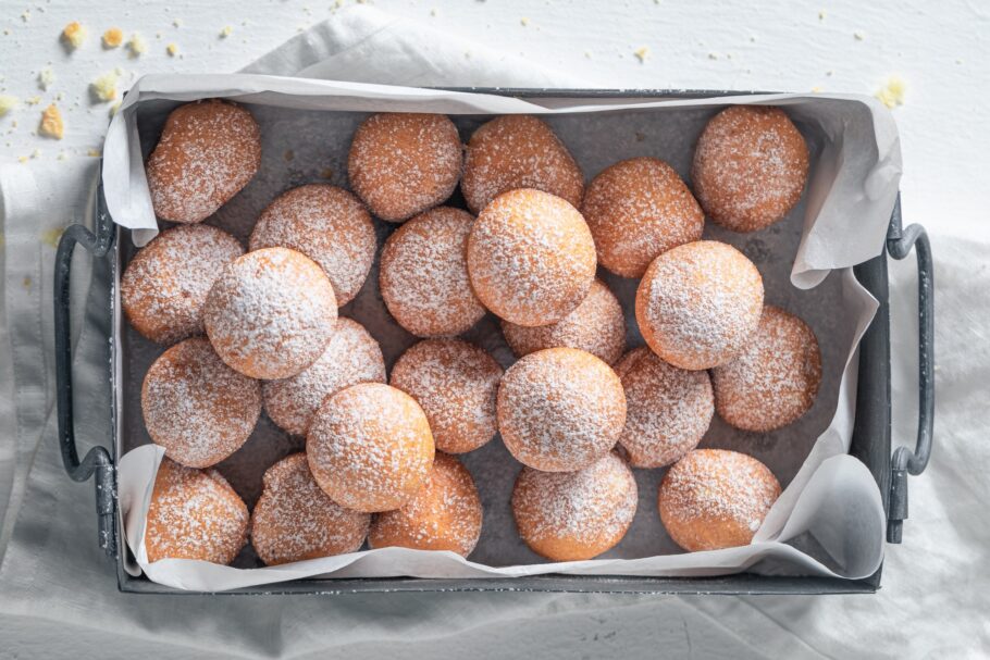 Sweet donut balls with powdered sugar. Donuts easy to make.